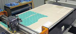 CNC fabric cutting machine cutting patterned material
