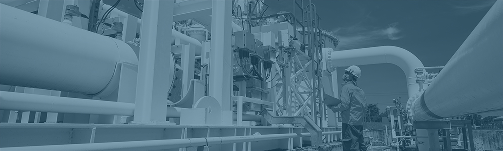 Male worker inspection at steel long pipes and pipe elbow in station oil factory during refinery valve of visual check record pipeline oil and gas industry