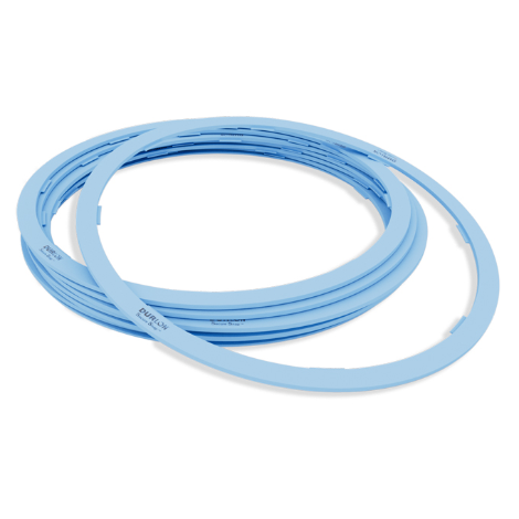 SecureSnap ptfe rail tank car gaskets stacked in large ring shapes for industrial sealing applications.